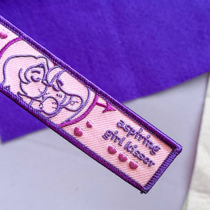 wuhluhwuh Girl Kisser Embroidered Flight Tag